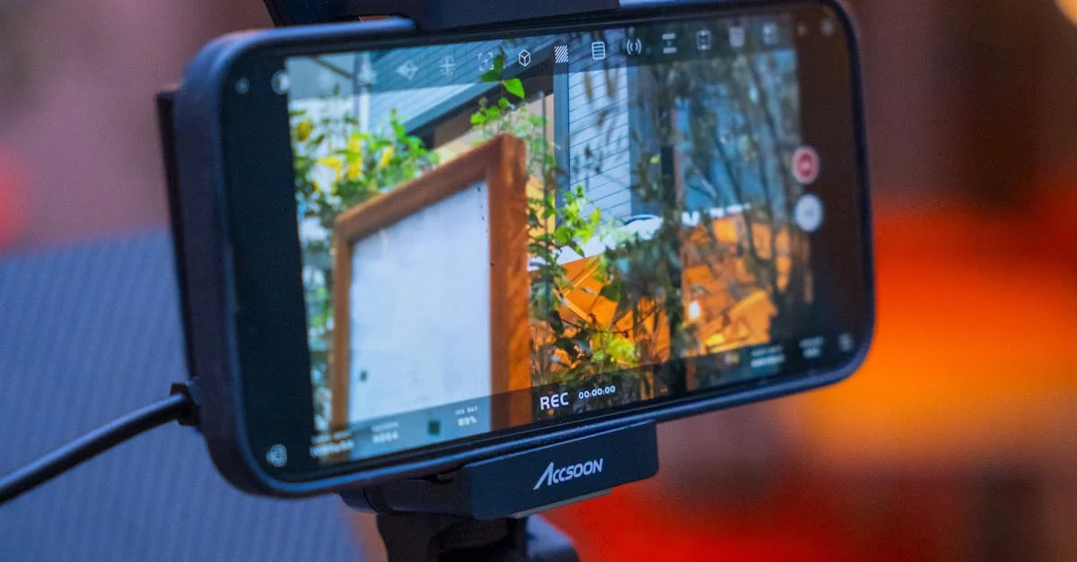 Close-up of a phone on a stabilizer recording outdoors with warm bokeh lighting.
