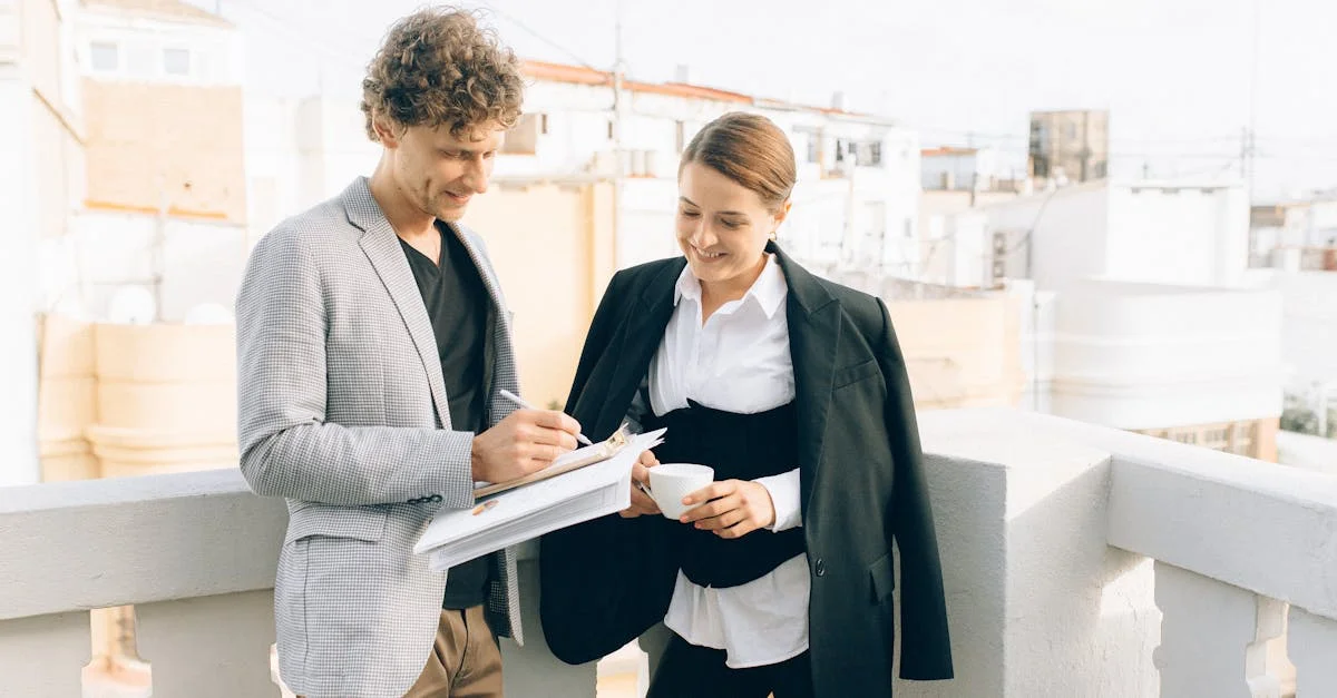 Two business professionals conversing on a rooftop, discussing strategies while enjoying a coffee break.