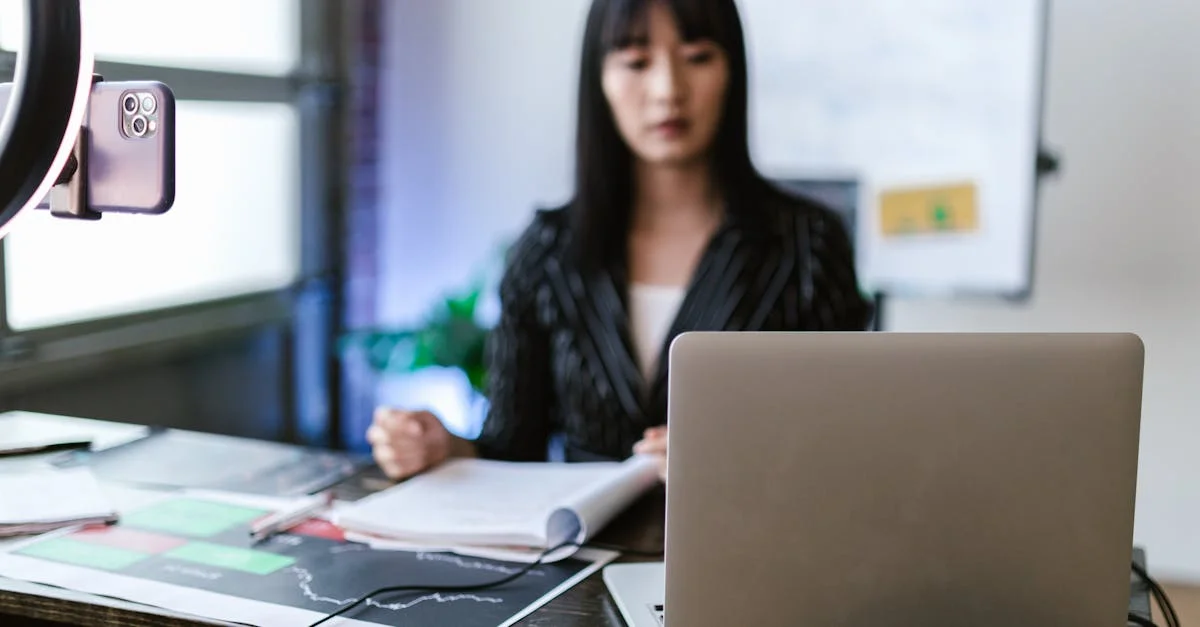 Focused woman trading stocks on a laptop in a modern office setting, capturing the essence of investment and technology.