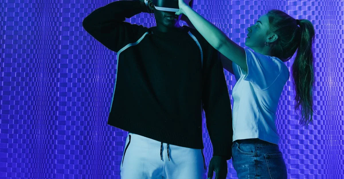 Man wearing virtual reality headset aided by woman in modern studio setting under blue lighting.